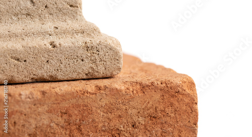 Macro texture of warm plaster wall with soft botanical shadows and copy space