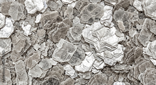Layered mica flakes revealing complex internal stratum architecture and glittering geological strat
