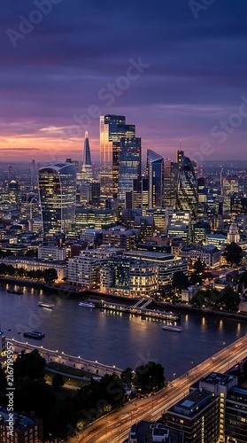 Illuminated London skyline and Thames river at twilight.