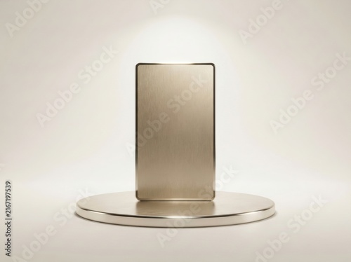 Gold credit card standing upright on a circular metallic disc against a white background.