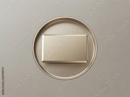 Blank gold credit card resting on a circular metallic plate, luxury financial concept.