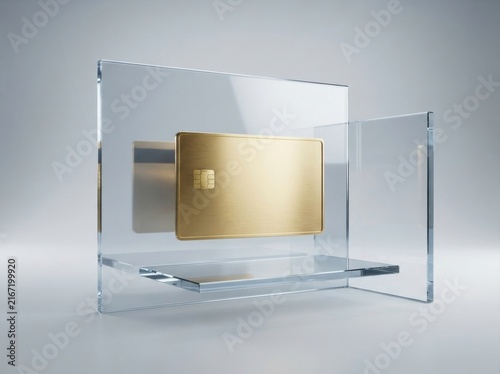 Gold credit card placed on a transparent glass stand for luxury banking and finance concept.