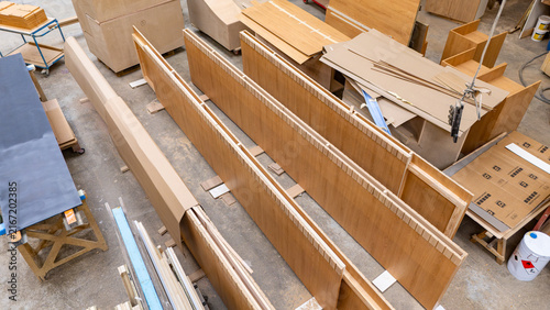 Foto Stacked timber packages in a woodworking workshop