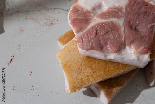 Obraz na płótnie Raw pork leg slab in a home kitchen: unpolished meat texture and documentary rea