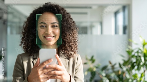 Professional using facial recognition biometric security on a smartphone