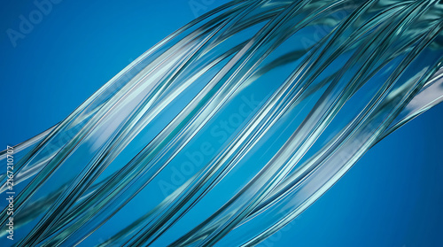 Abstract blue flowing silk fabric waves with light reflection