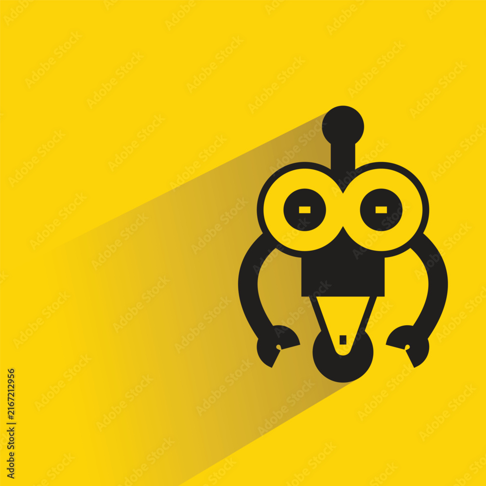 Fotografie droid robot with shadow on yellow background