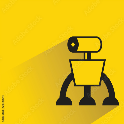 Obraz na płótnie droid robot with shadow on yellow background