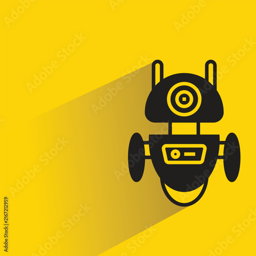 Konstfotografi droid robot with shadow on yellow background