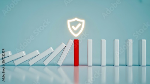 Business protection concept with shield preventing falling dominoes and reducing risk
