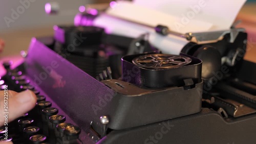 Close Up of Mechanical Typewriter Arms Striking Text