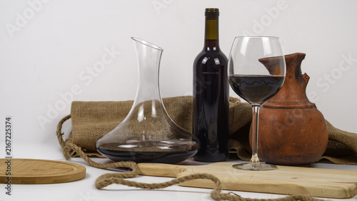 Obraz na płótnie Rustic red wine still life with bottle, decanter and glass