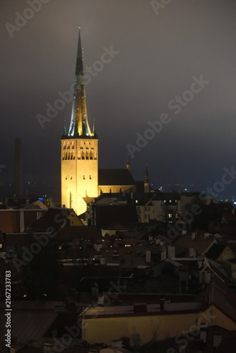 Outdoor high-angle view of St. Olaf's Church illuminated at night in Tallinn, Estonia
