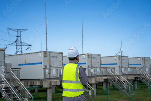 Engineer inspecting energy storage facilities at renewable power plant