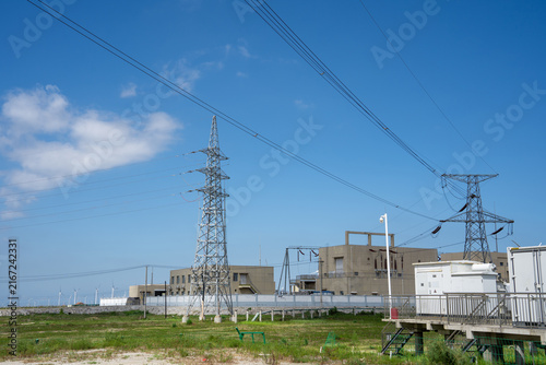 Power Substation with Transmission Towers Under Clear Blue Sky