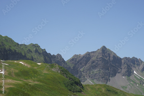 Rocky Alpine peaks with snow patches in Melchsee‑Frutt, Switzerland.