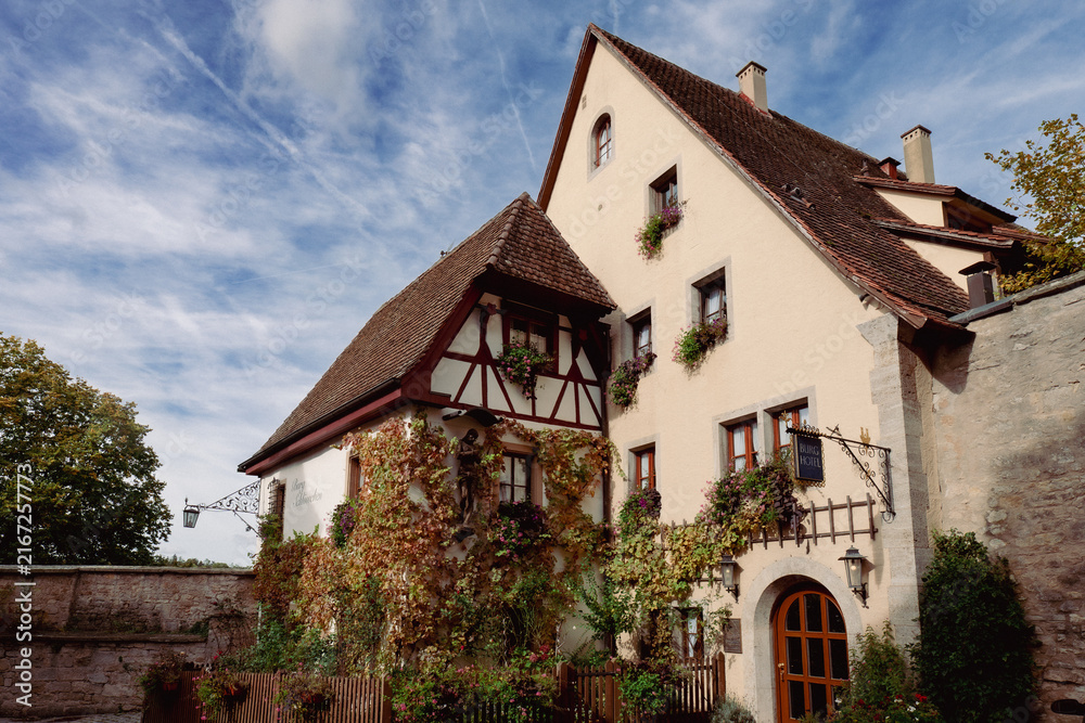 Obraz premium historic building right next to the city walls of the medieva city of Rothenburg ob der Tauber
