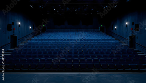 Concert stage with colorful led lights and empty silhouettes at night