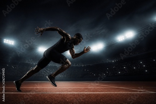 Track Sprinter Silhouette Under Night Athletic Lights