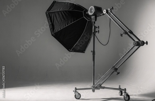 Studio lighting equipment with softbox on a wheeled stand
