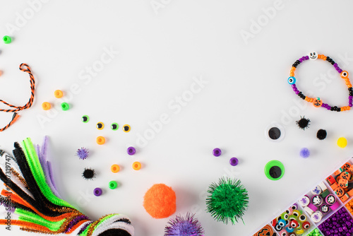 A set of diverse and colorful materials for children's Halloween crafts. Copy space