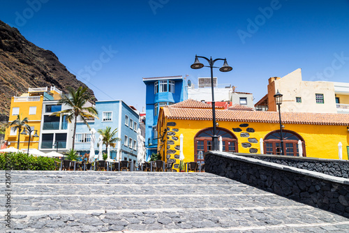 Colorful waterfront buildings and paved square in Puerto de Tazacorte, La Palma.