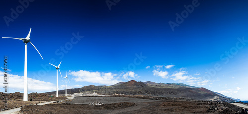 Panoramic view of wind turbines on black volcanic field in Fuencaliente La Palma
