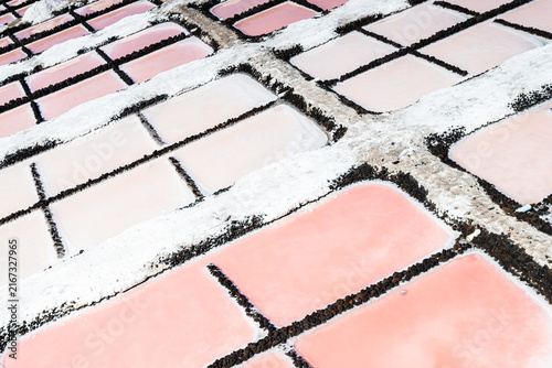 High-angle close-up of pink salt evaporation pans at Salinas de Fuencaliente La Palma