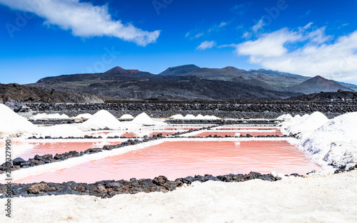 Pink salt pans with mountains and volcanic cone in Fuencaliente La Palma