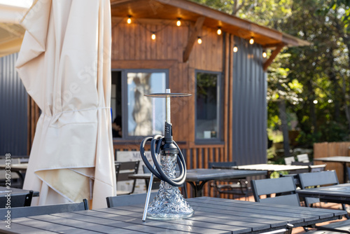 Hookah on table at outdoor cafe terrace during daytime