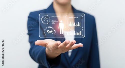 Woman presenting futuristic digital interface with data charts and global information