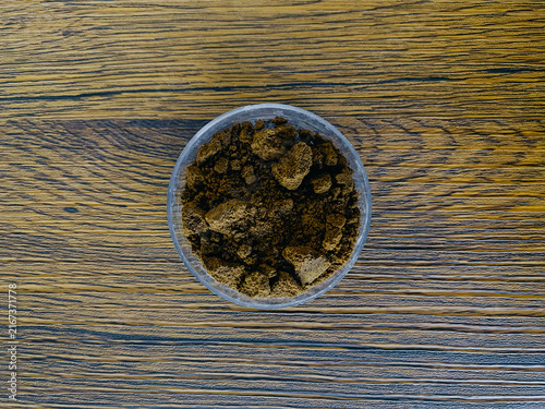 Ashtray with coffee grounds for protection bad smell inside. Top view.