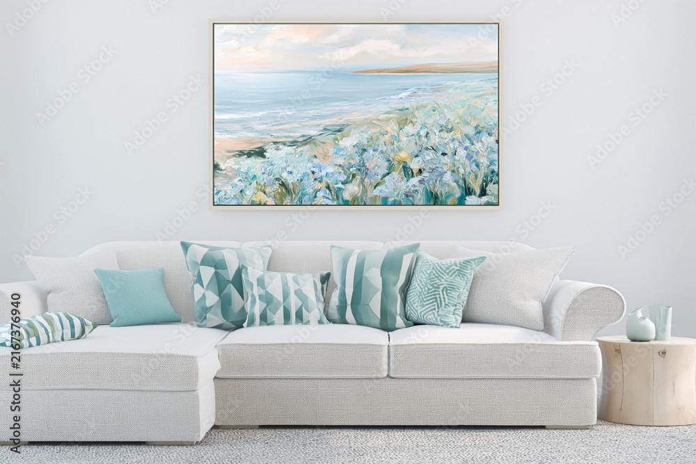 Fototapeta premium Coastal living room interior design featuring a comfortable sofa with decorative pillows and a large beach landscape painting