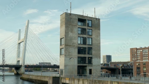 crystal-clear architectural 4K wide shot captures the Zalmhaven high-rise residential tower alongside the Erasmus Bridge in Rotterdam showcasing a modern skyline and urban design perfect for