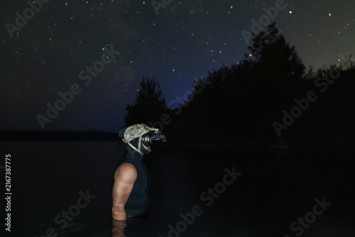 Foto Profile view of tactical diver wearing night vision head harness in lake under s