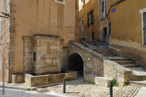 Bonnieux Dolphin Fountain with two mascarons in the shape of dolphins, Provence, France