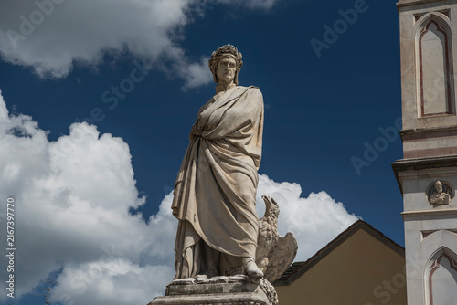 A statue of Dante Alighieri near the basilica of Santa Croce in Florence Italy