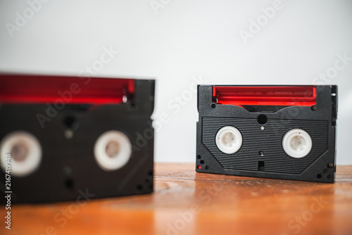 Vintage cassette tapes and camera on wooden desk