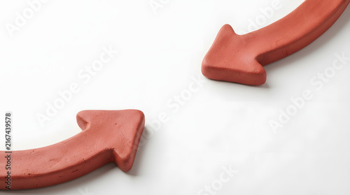 Red clay arrows pointing in opposite directions on white background