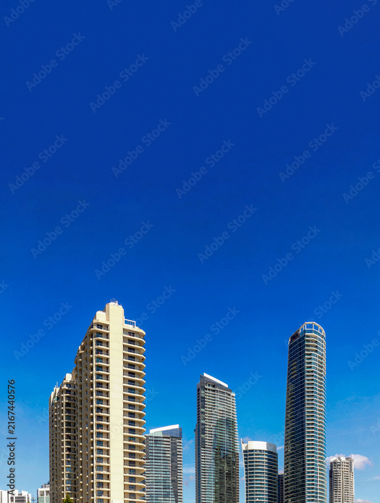 Fototapeta premium Gold Coast city skyline with modern skyscrapers against blue sky