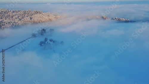 Majestic Aerial View of Foggy Winter Landscape at Golden Hour