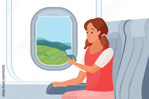 Photography Woman sitting by airplane window seat, holding smartphone and looking outside at