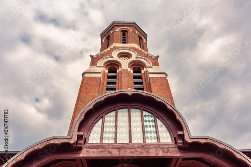 Low angle view of red brick bell tower at Curtea de Arges Monastery in Arges County, Romania