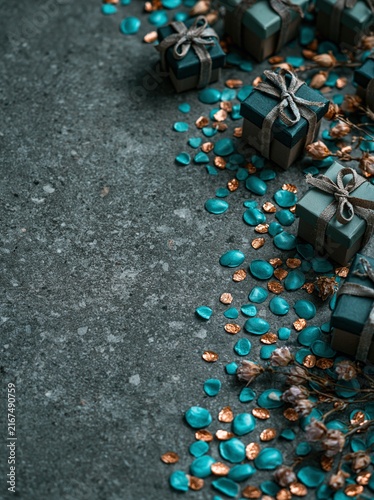 Dark Teal Gift Boxes with Bronze Confetti on Dark Stone