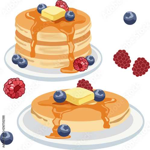 pancakes with syrup, butter, blueberries, and raspberries isolated on a white background