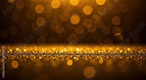 Golden necklace with round amber beads on wooden surface.