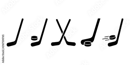 Photography Ice hockey sticks with puck in dynamic poses