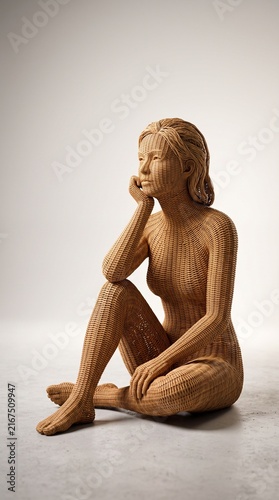 Detailed wicker rattan female sculpture sitting thoughtful pose on white background