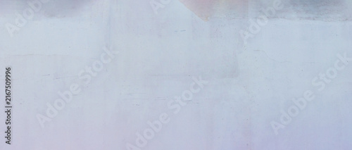 Full frame pale violet white stucco wall background featuring subtle blue scratches, faint pinkish stains, and a soft distressed texture, ideal for delicate pastel graphic overlays.