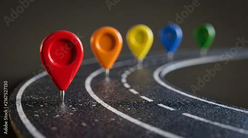 Colorful map pins arranged sequentially along parallel curving lanes